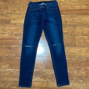 Just black skinny jeans with slits at the knee. Size 27